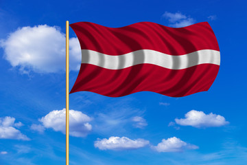 Flag of Latvia waving on blue sky background
