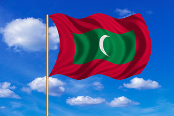 Flag of Maldives waving on blue sky background