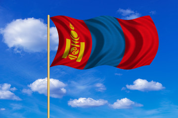 Flag of Mongolia waving on blue sky background