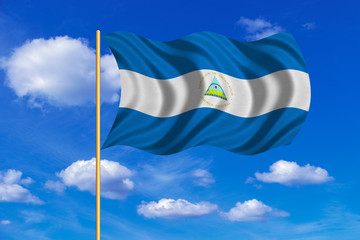 Flag of Nicaragua waving on blue sky background