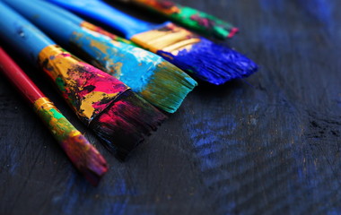 Fototapeta premium paintbrushes in dark background