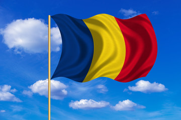Flag of Romania waving on blue sky background