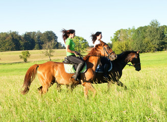 Two Women Horseback Riding in a Landscape