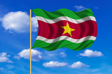 Flag of Suriname waving on blue sky background