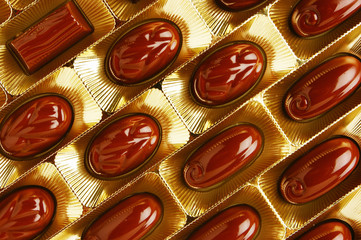 chocolate candies in a gold gift box