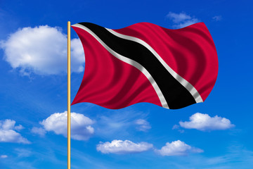 Trinidad and Tobago flag wavy on blue sky backdrop