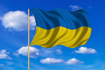 Flag of Ukraine waving on blue sky background