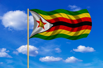 Flag of Zimbabwe waving on blue sky background