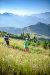 Fototapeta na wymiar Young couple hiking, Austrian alps