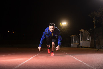 sprinter, sprinting, start position.