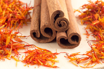 Macro view of the sticks of cinnamon and saffron