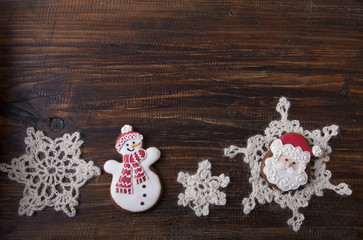 Christmas background with gingerbread in the form a snowman and