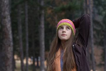 Little girl resting in forest