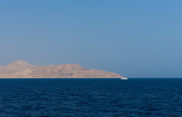 Fototapeta na wymiar Mountains on the uninhabited island near the sea