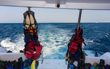 Lifejackets and other equipment for diving on back teak deck