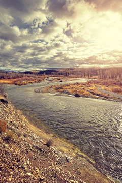 Vintage toned Snake River in the Grand Teton National Park at sunset, Wyoming, USA. © MaciejBledowski