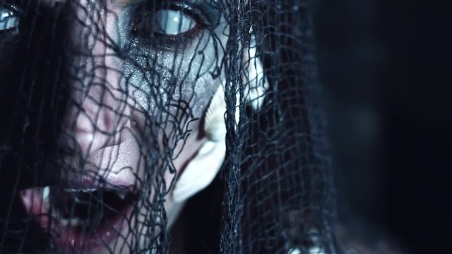 4k Halloween Shot of a Horror Woman Mermaid Grinning Vampire Teeth