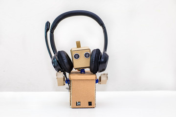 robot headphones black stands on a light background