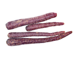 Colorful organic carrots isolated on white background