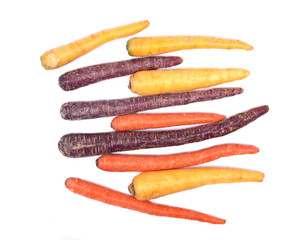 Colorful organic carrots isolated on white background