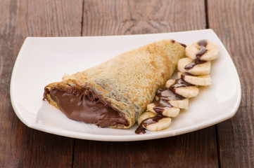 Crepes with chocolate cream and banana