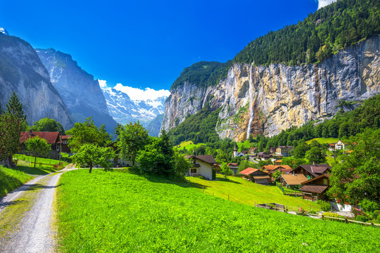 Famous Lauterbrunnen valley with gorgeous waterfall and Swiss Alps