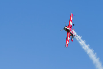 Small sports plane in the sky.