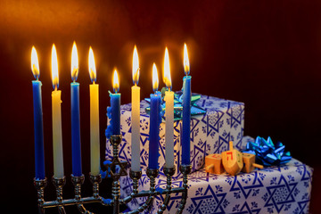 Jewish Holiday Hanukkah holiday with menorah burning candles. © ungvar