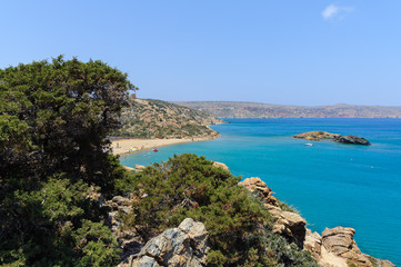 Lagoon with blue water and sandy beach at eastern part of Crete island