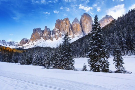 Winter views of the Geisler or Odle Dolomites mountain peaks in the Val di Funes (Villnosstal) in Italy. The surroundings of the village Santa Maddalena. Beautiful places for nordic ski.