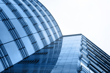 Fototapeta na wymiar Business centre abstract architecture glass perspective view. Sky background. Blue color horizontal