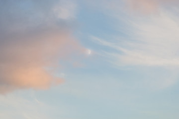 Fototapeta na wymiar Full moon sunset light clouds soft cloudscape