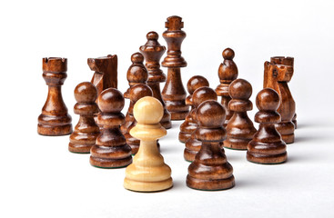 Chess. White pawn and Black figures on white background. Set of black figures. Background for presentation.