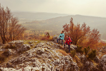 Landscape photo of two backpackers enjoying the view