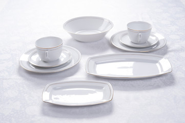 plate set on a white tablecloth, tableware 