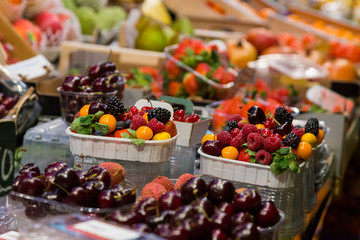 The absolute abundance of fresh vegetables, fruit in the European market. Barcelona, Spain, Market, Counters with food.