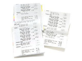 Pile of shopping receipts on white background
