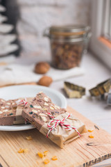 Festive chocolate block tied with string. Shallow depth of field.
