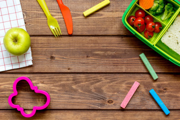 Obraz na płótnie Canvas ingredients for children's lunch on wooden background top view