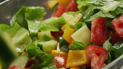 Salad preparation process. Process of mixing fresh salad. Shot on RED EPIC DRAGON Cinema Camera.