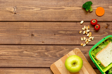 ingredients for children's lunch on wooden background top view