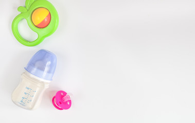 baby bottle with milk on white background top view