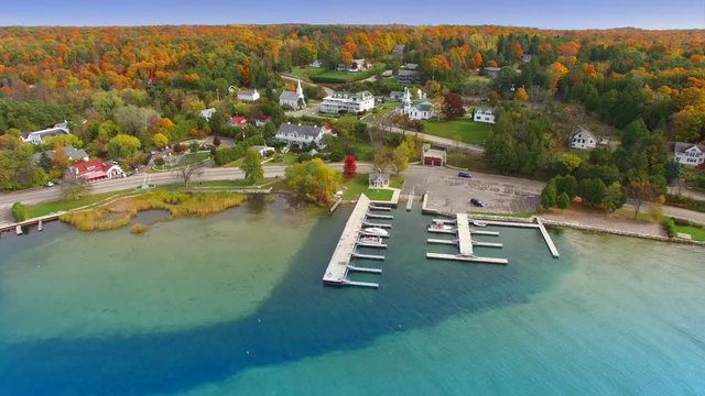 Flying over colorful autumn waterfront,  Door County Wisconsin.

