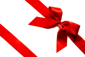 Red satin ribbon and bow isolated on white
