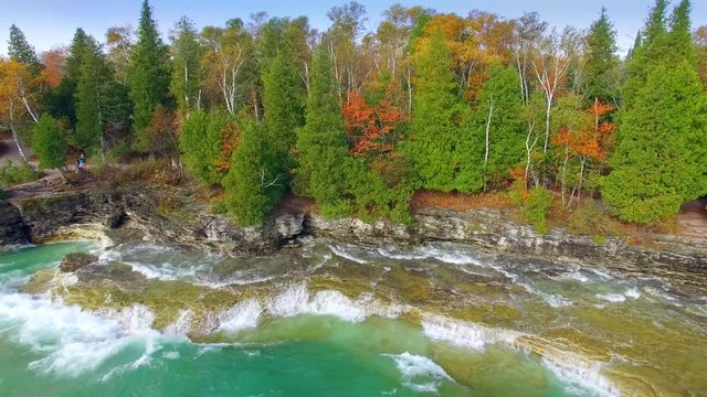 Emerald waves crash on rocky Autumn shores, Cave Point, Door County, Wisconsin. Lake Michigan&rsquo;s waves have been slapping these rocky shores for about 8000 years.