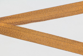 Gold ribbon isolated on a white background