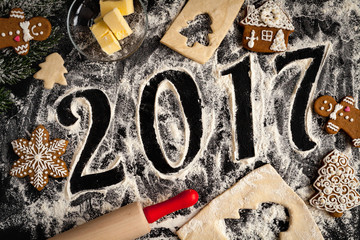 cooking christmas gingerbread on wooden background top view