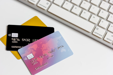 Credit cards with keyboard close up on white background