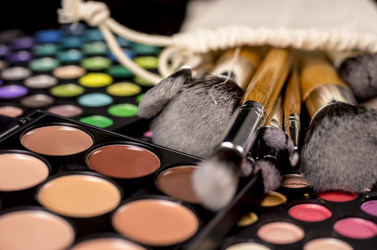 Vintage make-up brushes  on makeup palette