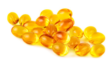 Vitamin E capsules on white closeup